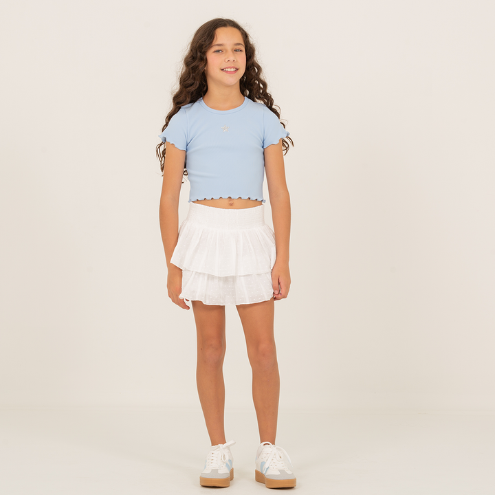 FALDA SHORT CON CAPAS Y DETALLES BORDADOS PARA NIÑA