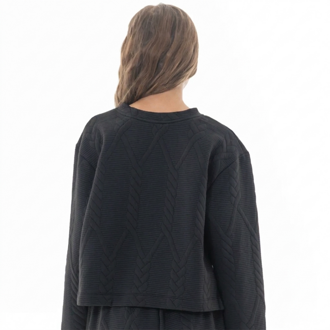 BUZO NEGRO PARA NIÑA CON TEXTURA GEOMÉTRICA